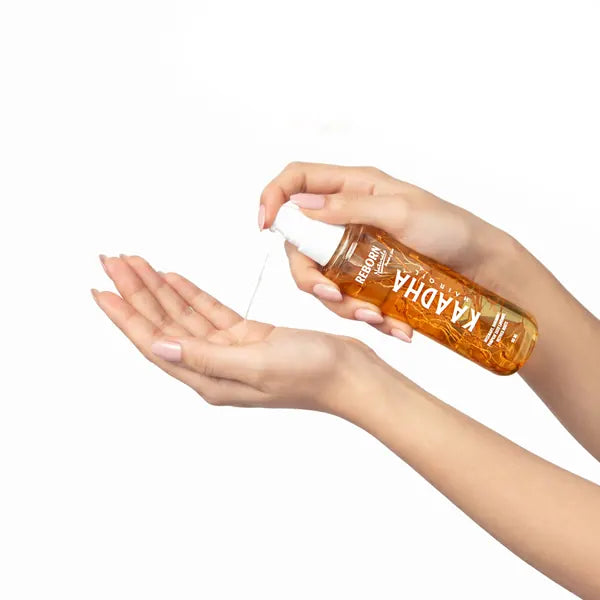 Kaadha Hair Oil in hand